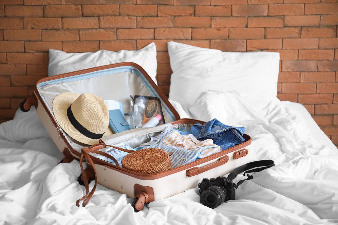 Open Packed Suitcase on Bed